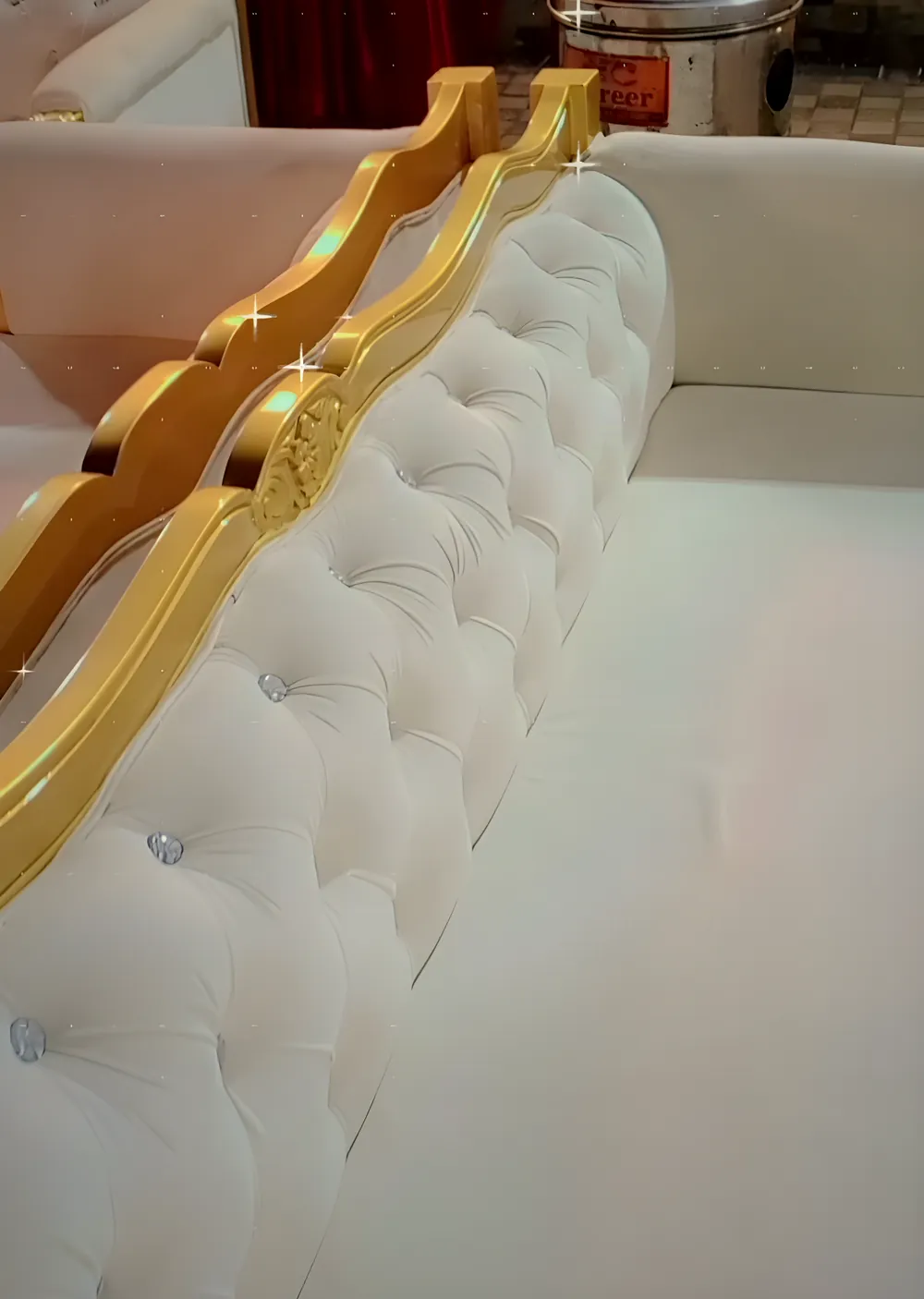 White stage sofa with a gold frame